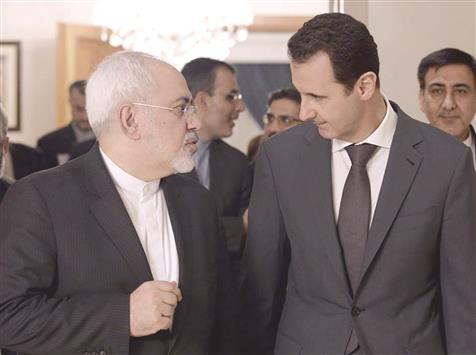 الأسد خلال لقائه ظريف في دمشق أمس («سانا»)