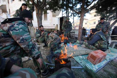 عناصر الجيش السوري في سلمى امس (أ ف ب ) 
