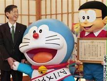 وزير الخارجية الياباني يقلد القط مهام منصبه الجديد